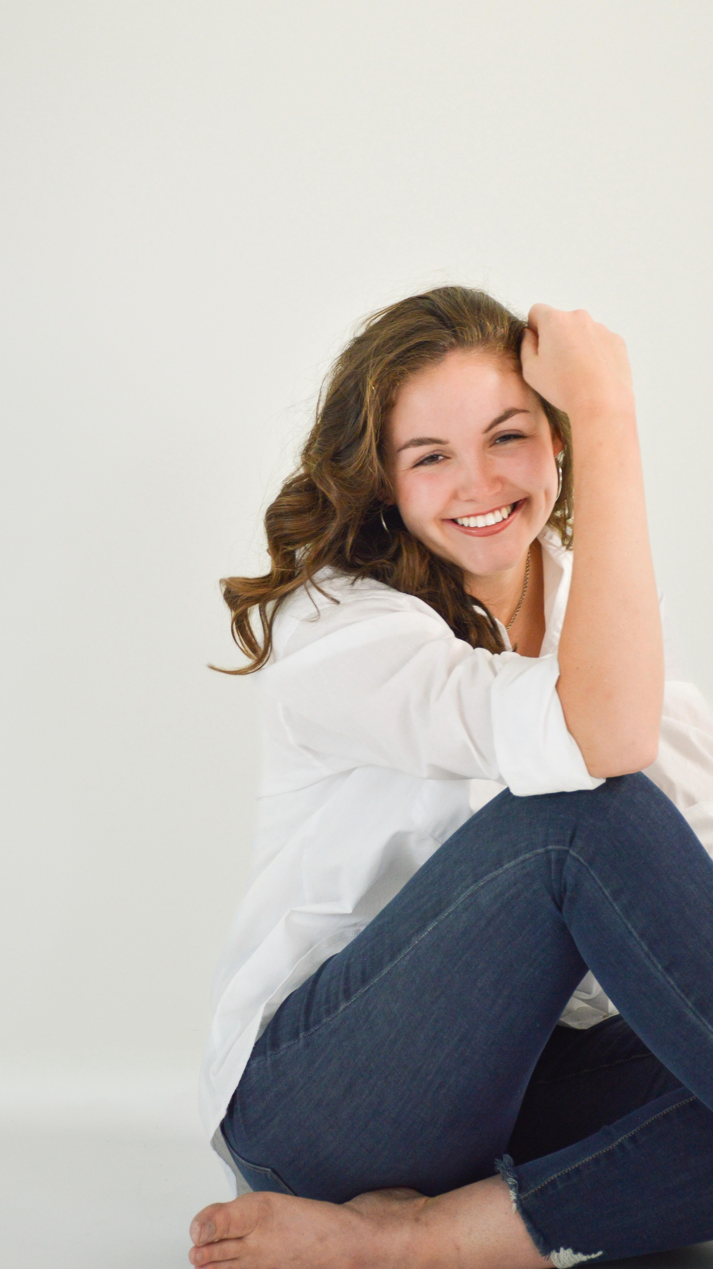 Casual studio portrait with a warm smile
